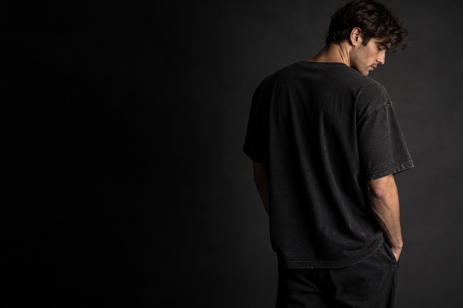 Model wearing an unbranded dark cotton T-shirt